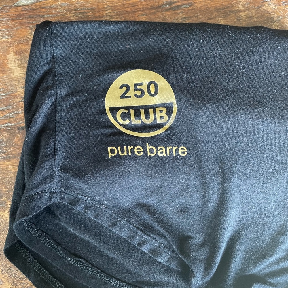 Pure Barre 250 and 500 class racer back tanks. Medium